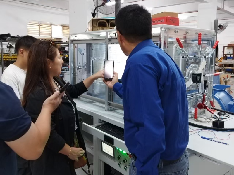 Peruvian Mining Client Visits FLUIOMET for Large-Flow AMCA 210 Wind Tunnel Project